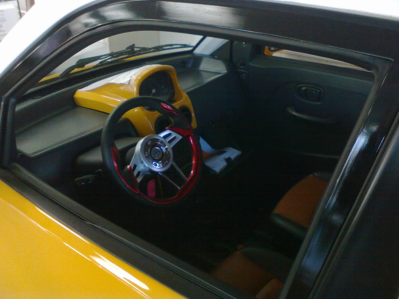 The steering wheel is tiny, but the color is rad! (Airbags were, believe it or not, optional.)